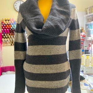 Soft wool/cashmere blend pullover w/side seam pockets, generous cowl neckline.